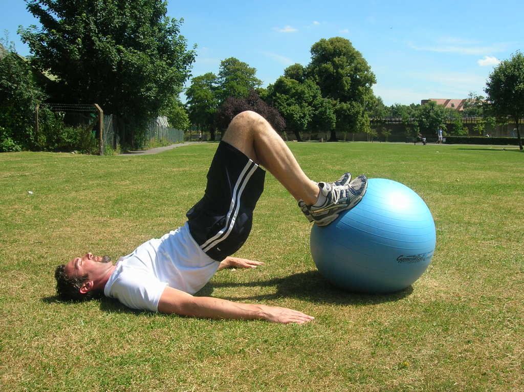 bridge lift with curl on fit ball